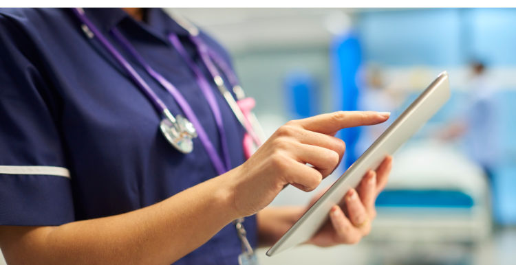 NHS staff with a digital tablet