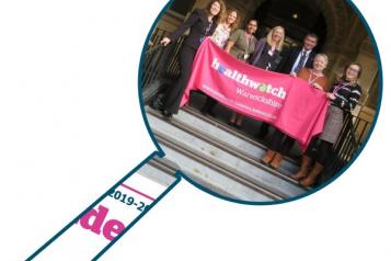 Staff team with Healthwatch Warwickshire banner