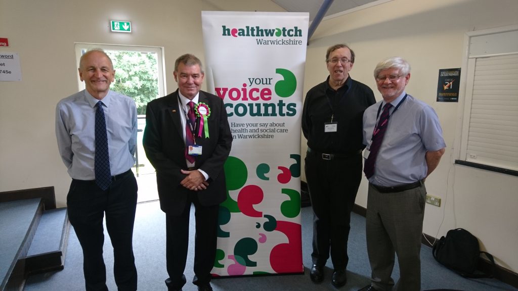 Picture of four men at a healthwatch event