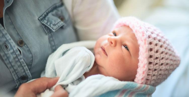 Woman holding a young baby