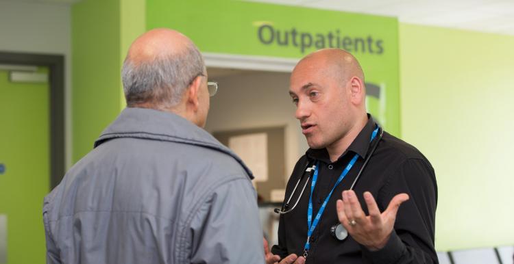 Doctor speaking with patient