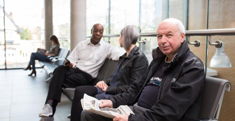 people in a hospital waiting area 