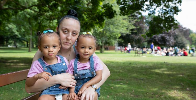 a lady with her 2 young daughters a lady with her 2 young daughters