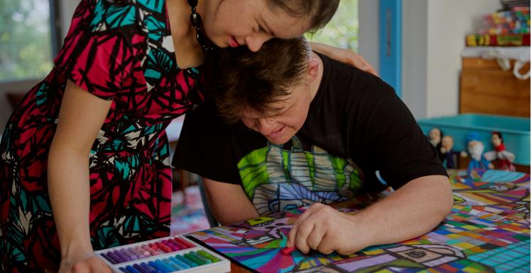 A young lady and man making art