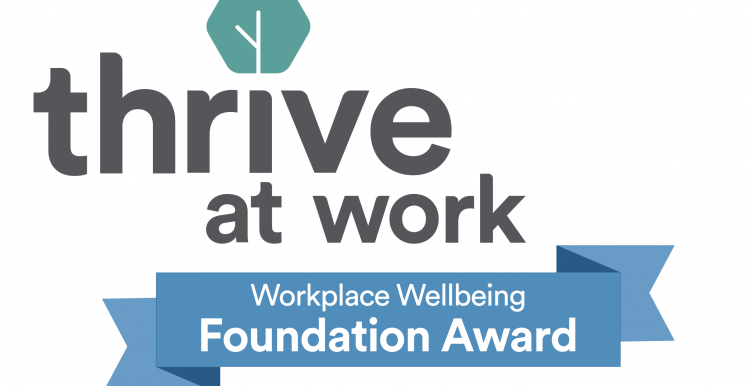Text reading 'Thrive at work Workplace wellbeing Foundation Award'