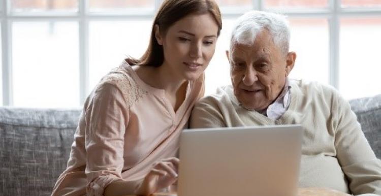 Man and woman looking at laptop