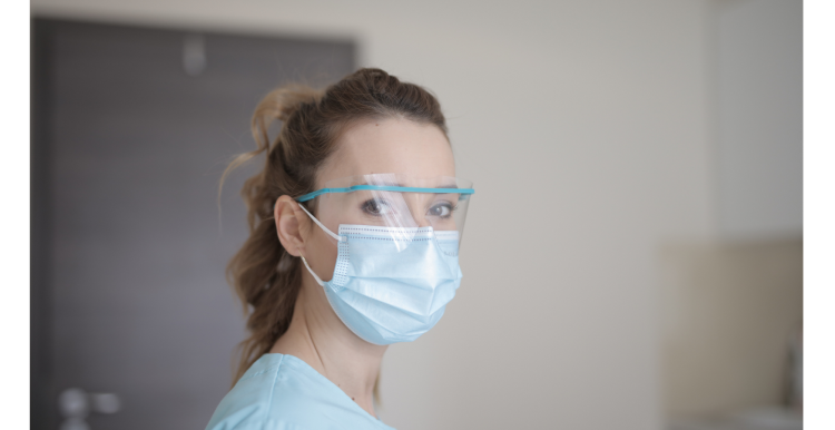 Health care staff wearing mask and goggles