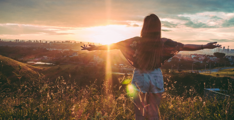 A girl watching the sunrise