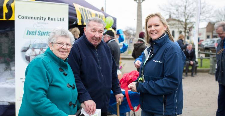 Healthwatch representative talking to an elderly couple