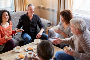 People chatting round a table