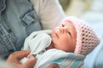 Woman holding a young baby