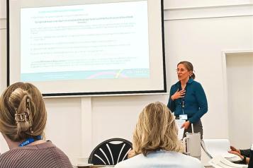 woman presenting to a group
