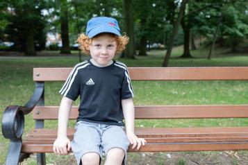 Child sitting outside