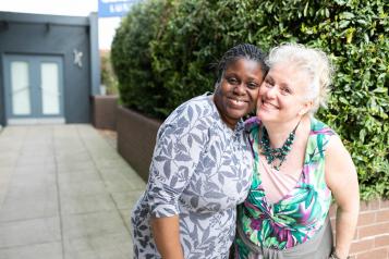 two ladies together laughing