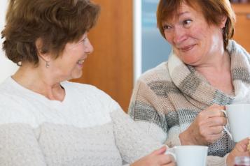 Ladies chatting with a cup of tea