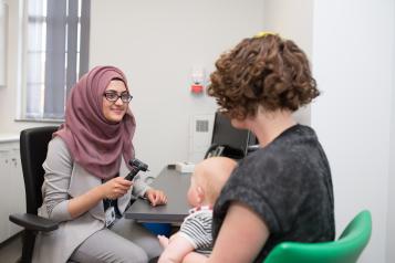 Doctor and person with baby