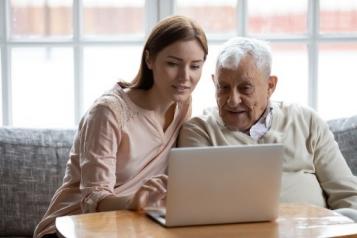 Man and woman looking at laptop