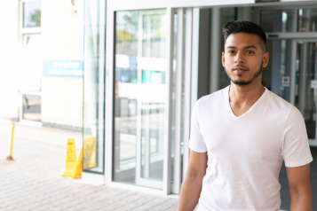 A young man outside a hospital