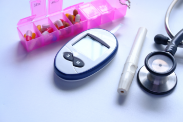 blood sugar monitor, tablets, a stethoscope