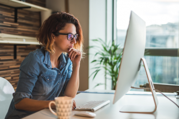 Woman looking at computer screen