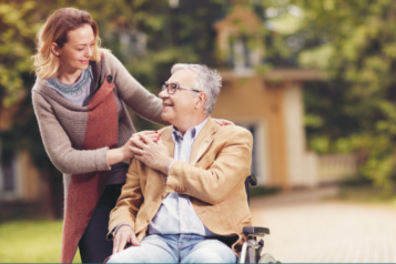 Lady with a man in a wheelchair