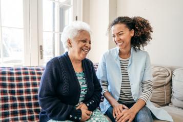 a lady laughing with an older lady