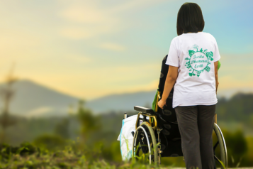 lady with a wheelchair user, outside