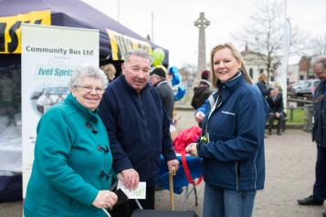 Healthwatch representative talking to an elderly couple