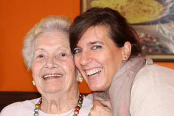 Lady laughing with an older lady