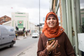 a lady holding a smartphone