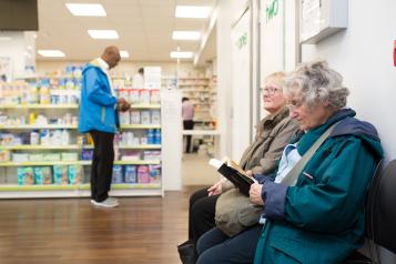 People waiting in a pharmacy