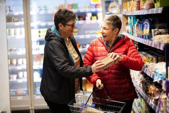 2 women shopping for food