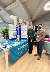 Staff member and volunteer with our information stand
