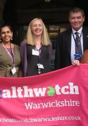 Staff team with Healthwatch Warwickshire banner